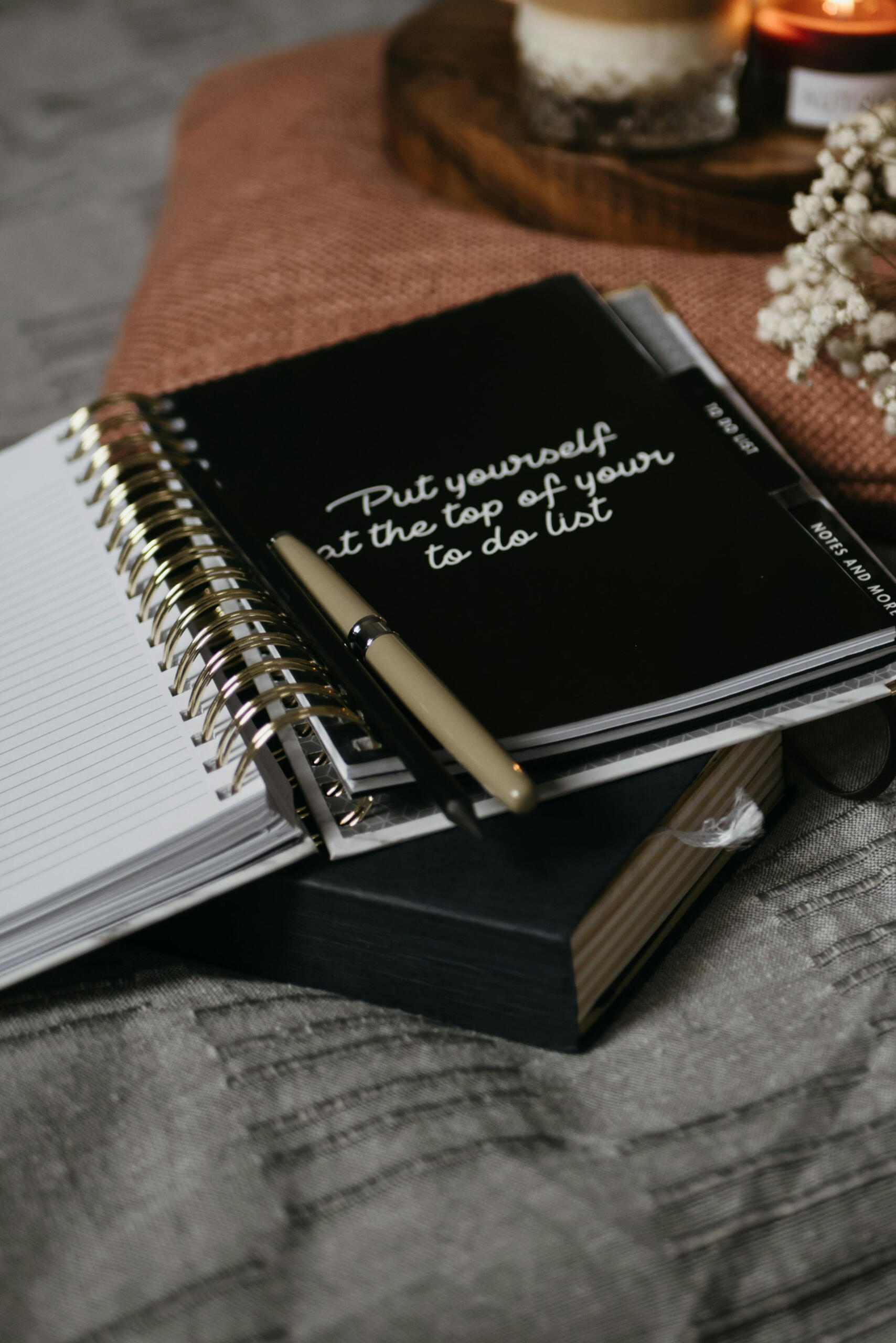 Notebook with ‘Put yourself at the top of your to-do list’ quote and a pen A journal with the quote ‘Put yourself at the top of your to-do list’, surrounded by soft textures and calm tones — inviting a moment of self-reflection.